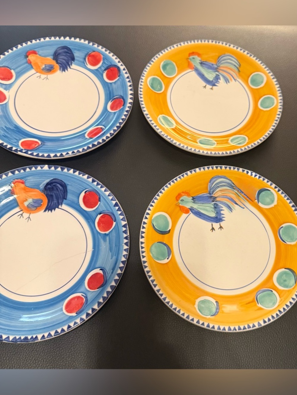 7 colorful hand painted salad plates, with chickens. Green, red, yellow & blue.